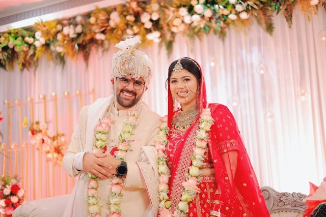 Bride and groom performing a traditional Hindu wedding ceremony under a decorated mandap with Hindu Priest Ketul Joshi.